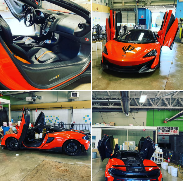 Detailing bay and a vehicle being cleaned